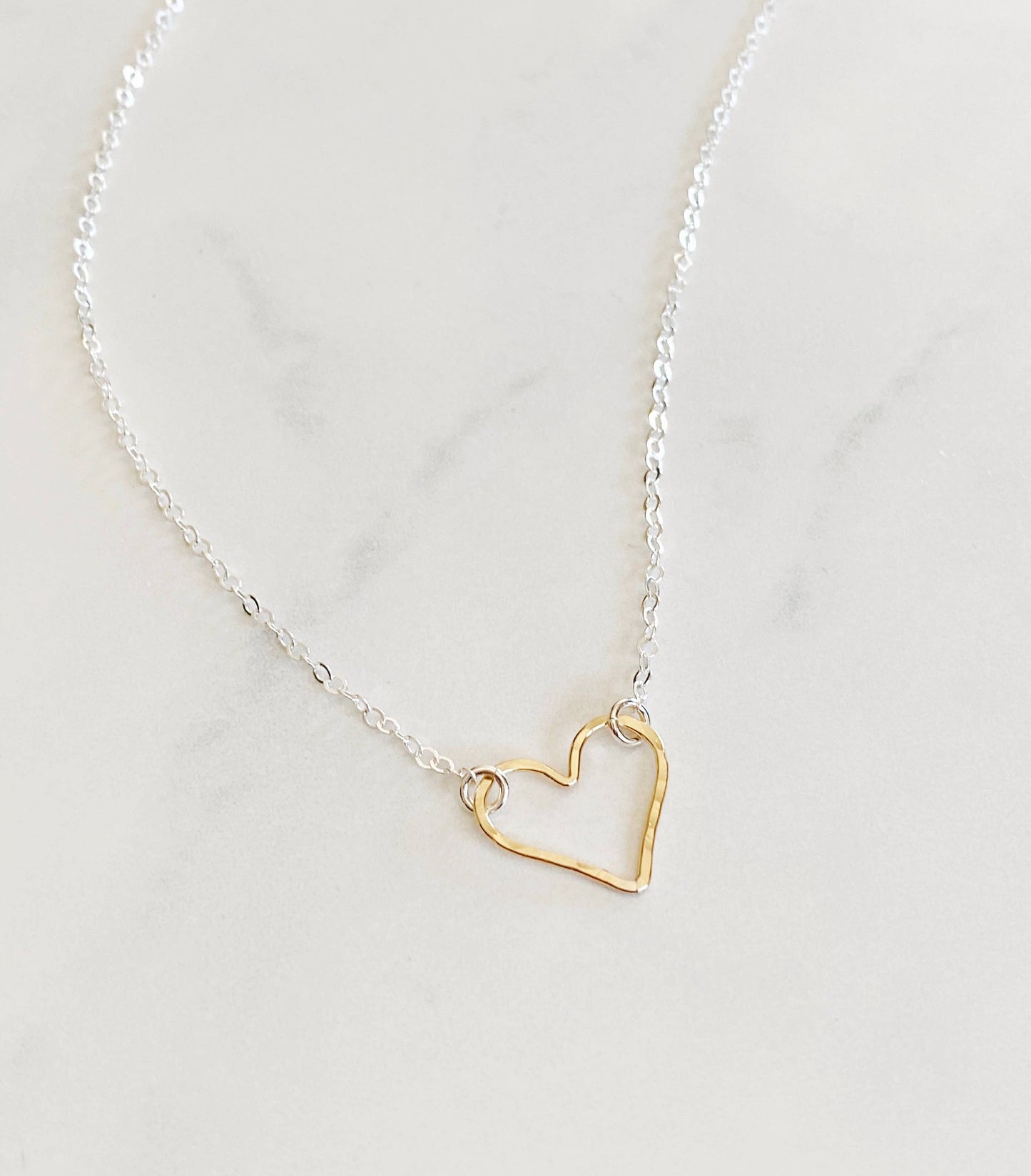 Mixed metal open heart necklace